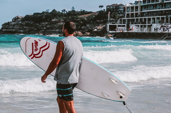 a surfer on Bondi Beach, a Sydney beach with parking