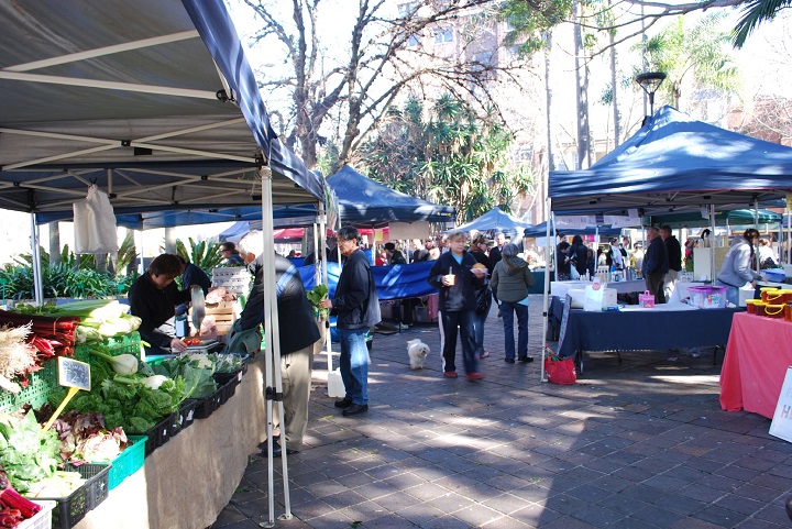 Shoppers and dogs enjoying a sunny weekend at Sydney's Kings Cross Markets