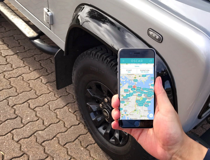 A woman near a car using the Share with Oscar app, that makes it easy to find Monthly Parking in Parramatta